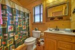 Loft Bathroom with a Tub / Shower Combo 